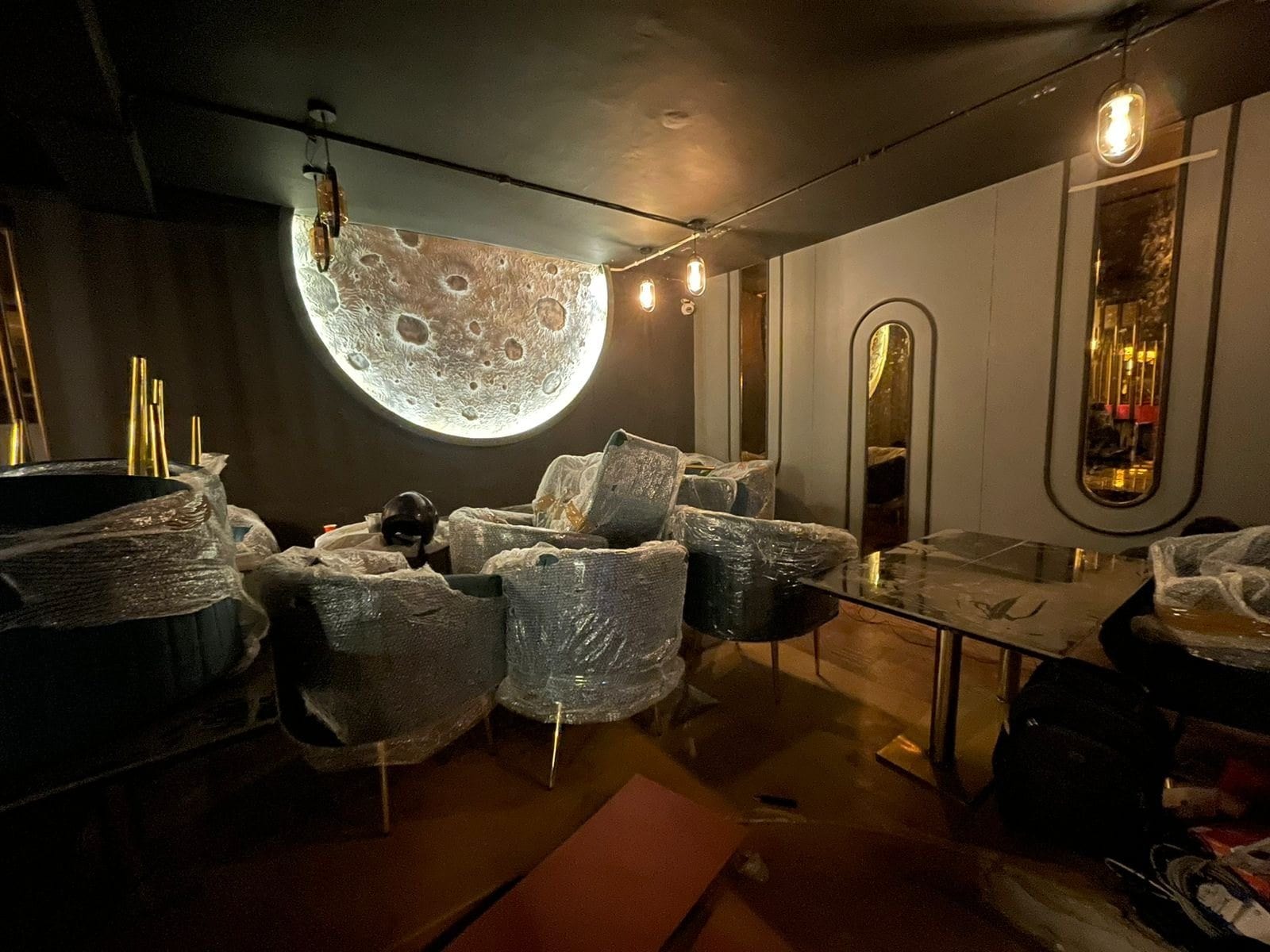 Café at Hudson Lane — moon feature wall in the lounge