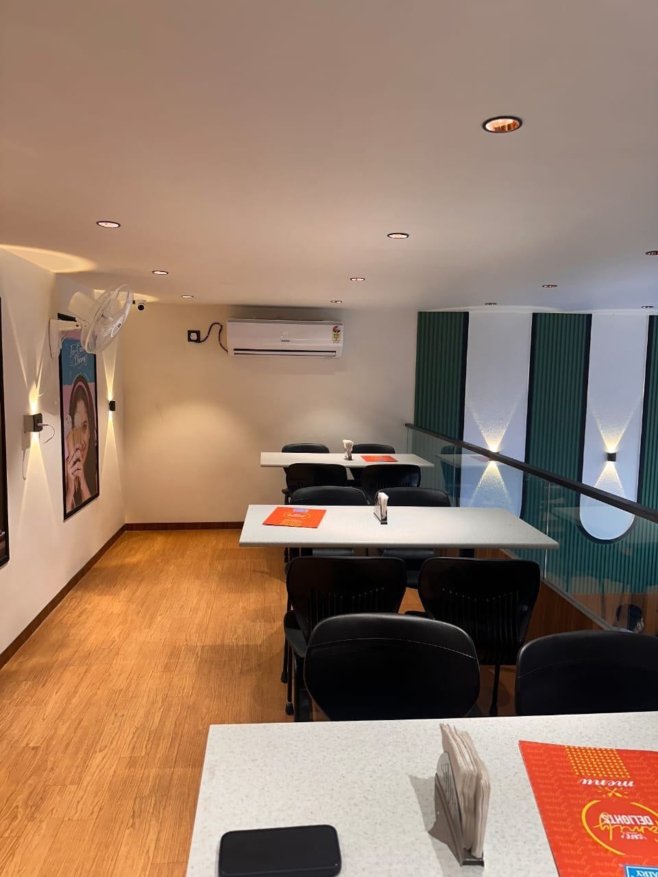 Mother Dairy Café, Sector 11 Noida — seating along the timber wall