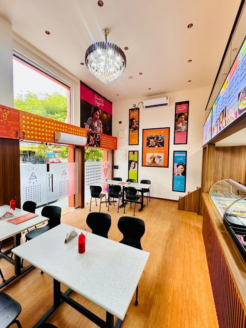 Mother Dairy Café, Sector 11 Noida — seating area and counter
